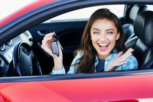 A woman driving a car insured with third party car insurance in Ireland