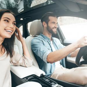 Man and a woman driving a car with fully comprehensive car insurance from Compare Insurance Ireland.