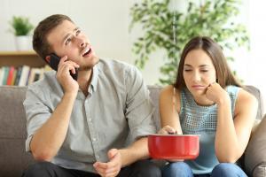 Couple submitting an insurance claim in Ireland for a bathroom leak.