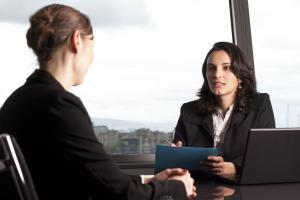 Loss adjuster in a meeting discussing an insurance claim.