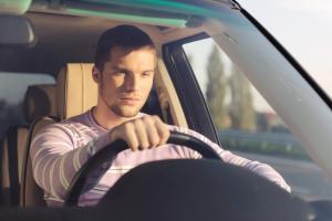 Man driving his dad's car in Ireland.