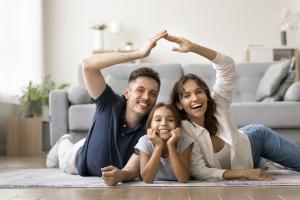 couple in their home with their daughter