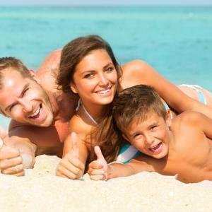 Family on holiday, passport and travel insurance reminder